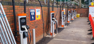 Electric vehicle charging stations lined up in a parking lot